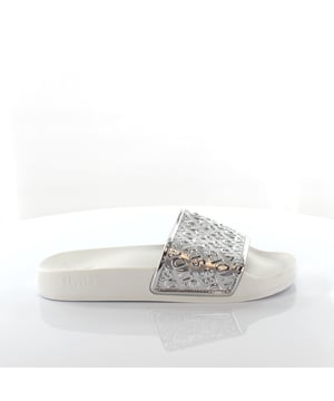 These sliders combine fashion-forward design with ultimate relaxation, making them the perfect choice for lounging by the pool or strolling along the beach.

Featuring a sleek white strap with eye-catching silver detailing, these sliders exude a modern and chic aesthetic. The metallic accents add a touch of glamour, elevating your summer look with a subtle sparkle.

Designed with a contoured footbed, these sliders offer superior comfort and support for your feet. The cushioned insole provides a plush feel, allowing you to walk or relax with ease. The slip-on style makes them convenient and effortless to wear, perfect for those laid-back days.

The lightweight construction and durable outsole ensure long-lasting wear and reliable traction. Whether you're walking on sandy beaches or exploring a resort, these sliders offer stability and grip.

Embrace the combination of style and comfort with the Slydes Sky Women's White/Silver Sliders. Whether you're lounging by the poolside or adding a trendy touch to your casual outfit, these sliders are a must-have accessory. Step into relaxation and enjoy the summer vibes with these fashionable and comfortable sliders from Slydes.