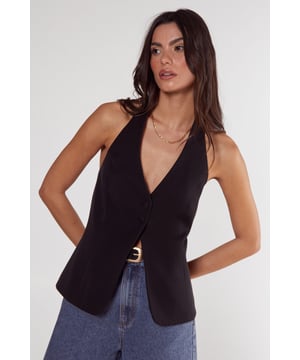 Sleek tailored vest with button front closure
        Plunging V-neckline for a sophisticated look
        Halter-style design with open back
        Single decorative button detail at the waist
        Versatile piece for layering or wearing alone
    
    Elevate your workwear wardrobe with this chic tailored vest from NastyGal's Essentials collection. Perfect for the modern professional, this sleek piece offers a contemporary twist on classic office attire. Style it over a crisp white shirt and pair with tailored trousers for a polished look that commands attention in the boardroom. For a more relaxed yet refined ensemble, layer it over a lightweight turtleneck and team with high-waisted wide-leg trousers. The vest's versatility shines through as day turns to night - simply pair it with sleek cigarette trousers and statement earrings for after-work drinks. With its ability to transition seamlessly from desk to dinner, this tailored vest is a must-have addition to any fashion-forward professional's wardrobe.