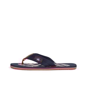 Mens Tommy Hilfiger Essential Beach Flip Flops in blue.- Synthetic upper.- Slip-on design.- Branded retro graphics.- Synthetic lining.- Rubber sole.- Ref.: FM0FM01369403
