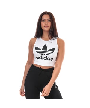 Womens adidas Originals Crop Top in white.<BR><BR>- Crew neck.<BR>- Sleeveless construction.<BR>- Large Trefoil logo printed to chest.<BR>- Cropped length.<BR>- Slim fit.<BR>- Measurement from shoulder to hem: 15“ approximately.  <BR>- Main material: 91% Polyester  9% Elastane.  Machine washable.<BR>- Ref: FL4079<BR><BR>Measurements are intended for guidance only.