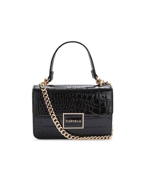 This Carvela Jessica Shoulder Bag features a patent black exterior with large croc print. There is a gold branded plate on the front flap. 13cm (H), 19cm (L), 6cm (D). Strap length: 67cm. Strap drop: 31cm.