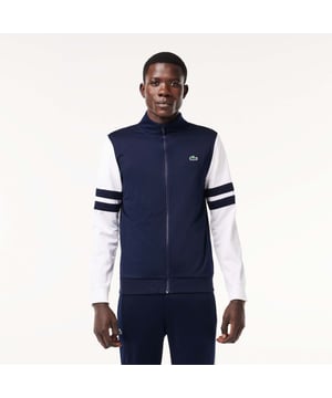 Designed for Tennis  for a regular frequency of use This product is in Interlock which guarantees you a resistant fabric making it adapted to high repetitive movements during training sessions. This sweatshirt is made in 100% recycled polyester and has 2 zipped hand pockets to secure your personal items. Classic fit: comfortable ease on body  with comfortable sleeves The technical capsule offers the complete seasonal wardrobe on and off court with a strong design identity. LACOSTE wording print at back neckline.