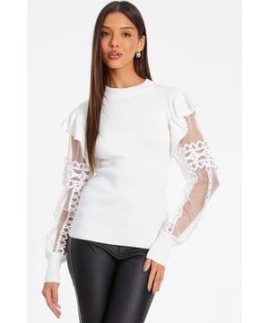 - Ribbed knit finish - High neck - Mesh sleeves - Lace detail - Model height: 5'8" - Model wears uk 8 / us 4 / eur 36 - Always check the care wash label - Cool hand wash with mild detergent