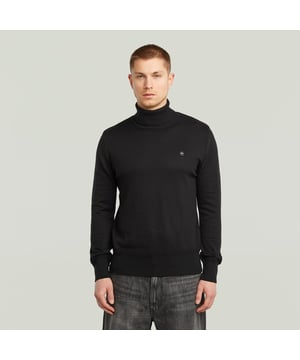Ribbed turtle neck. Ribbed finished cuffs and waist. Structure knit above the cuffs and waist. G-Star RAW embroidery at the chest. Information label at the lower front- remove hand stitch to detach. No closure. A knitted structure created out of fine yarns. The material mix in the yarns adds to a comfortable feel. Knitted turtle neck sweater Core features a straight fit with a ribbed, raised collar. Also the cuffs and waist are created out of a ribbed knit. A different structure is knitted straight above. The G-Star RAW embroidery at the chest signs it off. 50% Organic cotton 50% Polyacrylic. Built-in stretch