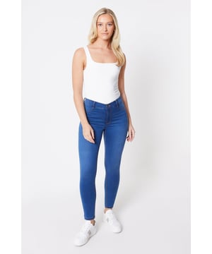 Introducing our latest addition to the wardrobe essentials - the Frankie Skinny Jean. Crafted with comfort stretch fabric, these jeans are perfect for daywear. Designed to flatter, they feature a slimming silhouette that hugs your curves in all the right places. Pair them with a black shirt for a chic and timeless look. Upgrade your style with these versatile and fashionable jeans that will effortlessly take you from day to night.