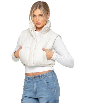 The Enzo Women's Puffer Gilet combines style and functionality with its water-repellent design and high neck for extra warmth. It features zipped side pockets for secure storage, while the adjustable hem with elasticated drawstrings ensures a tailored fit. With a full zip-up front and lined interior, this gilet offers both comfort and practicality. Made from 100% polyester, it's durable and machine washable for easy care.