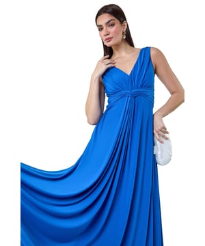 Plain Knot Front Maxi Dress from Roman. Turn heads in this luxuriously elegant knot front maxi dress. This exquisite sleeveless dress features a flattering v-neckline and a striking v-back detail, ensuring you make a sophisticated statement. With a fit and flare silhouette, this plain dress is fitted at the waist and flows into a floor-sweeping length, perfect for special occasions. The stretch jersey fabric drapes beautifully, while the knot detail at the waist adds an extra touch of glamour. Whether you're attending a wedding reception or a formal dinner, pair with strappy heels and a fascinator for a Summer wedding look.