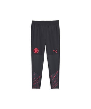 PRODUCT STORY: Calling all cityzens! Now you can show your support for Manchester City on and off the pitch. These pro pants come in the team colours feature dryCELL tech to wick away sweat as you exercise so you can give 100% in every training session. FEATURES & BENEFITS: Made with at least 20% recycled material as a step toward a better future; dryCELL: Performance technology designed to wick moisture from the body and keep you free of sweat during exercise. DETAILS: Slim fit; Elastic waistband; Official team crest; Single jersey and dobby fabric.