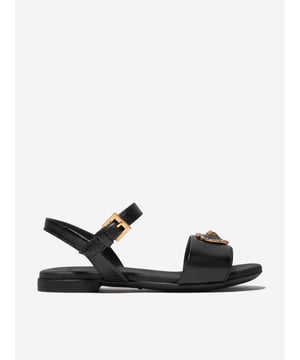 Introducing the Versace Girls Leather Heart Logo Sandals in Black, an opulent blend of Italian craftmanship and fashionable utility, perfect for holiday ensembles. Key highlights include: Italian-made: Born from the masterful techniques of Italian artisanship, rendering it durable and timelessly elegant. Heart Logo Accent: Elevate your child's style quotient with the iconic Versace heart logo, making these sandals a true statement piece. Supreme Comfort: Fabricated from premium leather ensuring comfort and ease, accompanying your child's every step.Transform the Holiday wardrobe! With these Versace Girls Leather Heart Logo Sandals in Black. Shop now for a taste of luxury for your little fashionista!