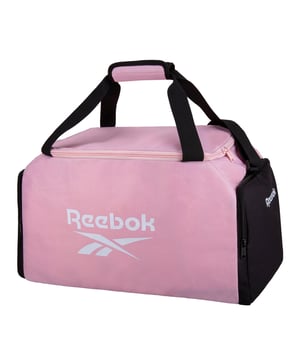 The Reebok Active Core Duffle Bag is for that person on the go who runs a stop for the gym, weekend getaways, or even business travel. This duffel bag offers an ideal blend of space, strength, and fashion.

It features a roomy main compartment, designed to hold a generous amount of clothing, shoes, and other items. The zip pocket is also easily accessible for storing keys, wallets, or even travel documents. Dual carry handles and an adjustable shoulder strap contribute to flexible carry options with convenience. The sleek, modern design of the Active Core Duffle Bag boasts the iconic Reebok logo for a look that's as stylish as it is functional.