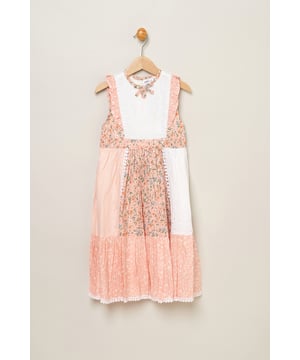 Let your little one blossom in this Miss floral patchwork dress! Designed with a keyhole tie neck and cute frill sleeves, it's a delightful addition to her wardrobe. Each patch tells a floral story, adding charm to every wear. Perfect for your stylish sweetheart to shine in any setting.