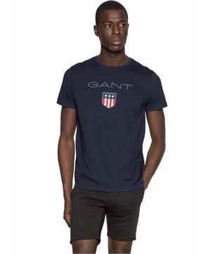 Mens Designer Gant Big Shield T-Shirts feature Short Sleeves and  a Crew Neckline. Gant Logo Printed on chest. Crafted With 100% Cotton, these Lightweight and breathable Regular Fit T-shirts are Machine Washable.