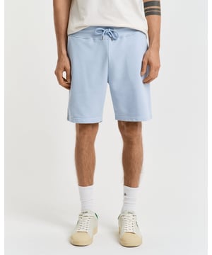  
 These classic sweat shorts are crafted from a soft cotton blend and come in a regular fit. They have a ribbed waistband for added comfort and feature two front pockets, a single back pocket, and a drawstring waist. 


Regular fit
Drawstring waist
Front pockets and back pocket
GANT graphic embroidered at left leg

 87% cotton, 13% polyester 

2009027
 