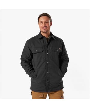 Dickies DUCK Herren Hemdjacke Schwarz\n\nVerschluss: Reißverschluss\n\nMerkmale: Verstellbar\n\nArtikelgewicht: 0,774 kg\n\nMaterialzusammensetzung: 100% Baumwolle\n\nBekleidungsmerkmale: Wasserabweisende Außenschicht und gestepptes Innenfutter, zwei Brusttaschen\nProduktcode: 36230-67585