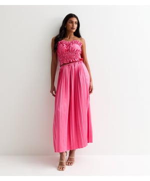 Indulge in luxury and elevate your style with our Hot Pink Ruched Bandeau Top. The stunning hot pink hue and ruched detailing add a touch of sophistication to your outfit, while the bandeau cut ensures a flattering fit. Step out in confidence and make a statement with this premium piece.