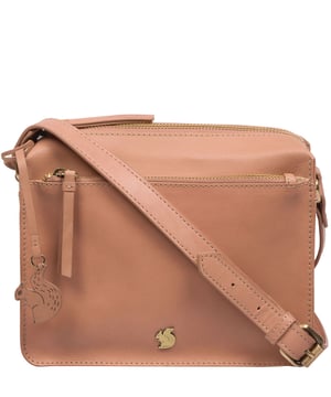 The 'Aurora' cross body bag from Conkca London elevates this classic design with a natural leather exterior for a beautifully smooth finish. A zip-over top conceals the central 100% cotton lined compartment alongside a handy slip pocket. Additional storage space is provided by a zipped pocket and slip pocket, ideal for on-the-go storage. The accessory comes with an adjutable leather strap secured with rustic gold metal fittings; this is all finished with the iconic Conkca London logo and charm.