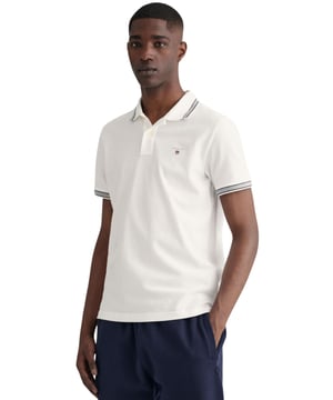 Elevate your wardrobe with our timeless Regular fit Short sleeves cotton piqué shirt. Featuring herringbone detailing on the collar and cuffs and an embroidered GANT shield on the chest, this sporty classic is made of lightweight, breathable fabric (2063005)