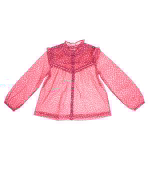Girl's blouse with a delicate floral design that stands out for its romantic and feminine style.

 Made from a lightweight, semi-sheer fabric, this garment features a print of small flowers on a contrasting background on the yoke, adding a touch of depth.

 It features a front button closure that adds elegance and practicality.

 Long, slightly puffed sleeves end in elasticated cuffs for a comfortable fit.

 The gathered high neck and ruffles on the shoulders complete this charming and sophisticated look, ideal for special occasions or to add a unique touch to any outfit.
 Composition: 100% Cotton
 Care:
- Machine wash max. 30ºC..
 - Use similar colors in the wash.
 - Avoid the use of bleaches.
 - Dry at low temperature.
 - Iron at low temperature.
 - Do not dry clean.