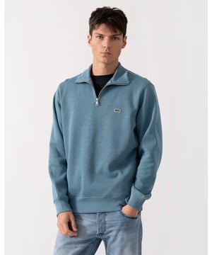 Ribbed cotton interlock
Zip ribbed stand up polo collar
Tone-on-tone ribbed finishes at bottom of garment and sleeve ends
Classic Fit
Embroidered green crocodile on chest
Cotton (100%)