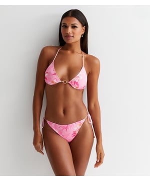 Introducing our Pink Floral Print Bikini Bottom, the perfect addition to your vacation wardrobe. Made with a beautiful pink floral print, these bikini bottoms are both stylish and comfortable. Elevate your beach look with our luxurious swimwear.