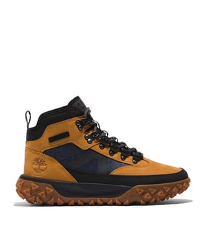 Mens Timberland Greenstride Motion 6 Mid Waterproof Hiking Boots in wheat.- Upper made with waterproof premium Timberland® leather and ReBOTL™ fabric containing at least 50% recycled plastic.- Lace-up style.- Fully gusseted tongue.- Removable contoured sockliner.- GreenStride™ midsole made using an EVA blend including at least 65% biobased materials derived from sugar cane and responsibly grown rubber.- Rubber outsole.- Ref: A67JC2311