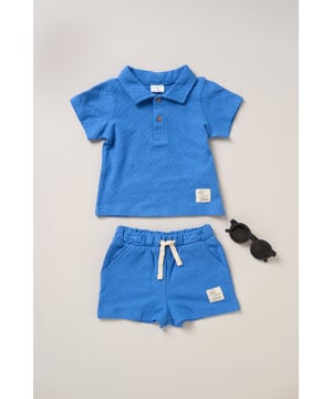 This Jacquard Jersey Polo Shirt, Shorts, and Sunglasses Set from Lily and Jack is made for cool dudes! With a stylish polo, comfy shorts, and trendy sunglasses, this set has everything your little one needs to look effortlessly cool while staying comfy and ready for adventure.