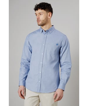 Textured woven fabric for added visual interest
        Button-down collar for a classic look
        Long sleeves with buttoned cuffs
        Subtle embroidered logo on the chest
        Back yoke with centre pleat for enhanced comfort
    
    This Maine long sleeve shirt offers a perfect blend of style and versatility for the modern British gent. The textured fabric adds a touch of sophistication to your casual wardrobe, making it ideal for various occasions. Pair it with chinos and white trainers, as shown, for a relaxed yet put-together look perfect for family gatherings or weekend outings. The button-down collar and clean lines allow for easy transition from day to night, making it a go-to choice for impromptu after-work drinks. For a smart-casual ensemble, layer it under a navy blazer and team with dark denim jeans. The subtle embroidered logo adds a refined touch without being overstated, embodying the understated elegance of British style. Whether you're heading to a casual business meeting or a laid-back dinner with friends, this shirt will ensure you look effortlessly stylish.