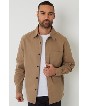 Ideal for transitional dressing, this cotton shacket from Threadbare is designed in a button-through style. It features a chest pocket and mock horn buttons on the cuffs, while a back yoke seam and side splits give it a tailored feel. Button up or wear open with a simple tee, or layer over a fine knit for in-between seasons. Perfect for laidback days when you still need to look on point.