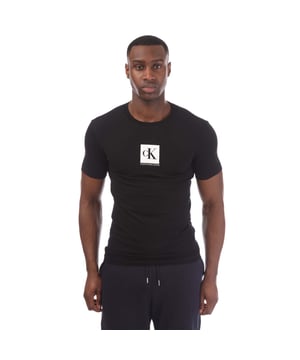 Mens Calvin Klein Monogram Logo T-Shirt in black.- Ribbed crew neck.- Short sleeves.- Calvin Klein Jeans logo.- Regular fit.- 94% Cotton  6% Elastane.- Ref: J30J314755BAE