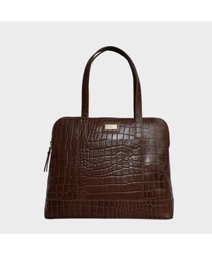 The designer 'Eva' tote bag in black real croc leather is a beautiful timeless design chosen for its lightweight characteristic. Unlined and spacious interiors ensure that you don't run out of space whether you're commuting. Add a touch of sophistication to all your outfits with the 'Eva' tote bag, a must have addition to your collection of handbags. Zip top opens to a roomy interior providing extra security to your belongings. Comes unlined with an exposed, soft to the touch natural leather interior. Extremely lightweight and leather handle for a comfortable carry on your shoulder. Slip pockets on either side to slide in your essentials. Adorned with the inimitable Assots London brushed gold metal logo for that designer look. Fittings Colour: Antique Brass. Composition: Body: 100% Genuine Leather. Lining: Unlined.
DISCLAIMER : All pictures shown are for illustration purpose only. Actual product colour may vary due to different ambience lighting or the screen display settings. Size- W36cm x H28.5cm x D10.5cm.