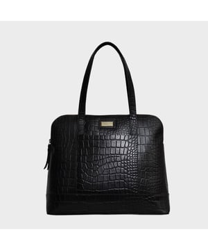 The designer 'Eva' tote bag in black real croc leather is a beautiful timeless design chosen for its lightweight characteristic. Unlined and spacious interiors ensure that you don't run out of space whether you're commuting. Add a touch of sophistication to all your outfits with the 'Eva' tote bag, a must have addition to your collection of handbags. Zip top opens to a roomy interior providing extra security to your belongings. Comes unlined with an exposed, soft to the touch natural leather interior. Extremely lightweight and leather handle for a comfortable carry on your shoulder. Slip pockets on either side to slide in your essentials. Adorned with the inimitable Assots London brushed gold metal logo for that designer look. Fittings Colour: Antique Brass. Composition: Body: 100% Genuine Leather. Lining: Unlined.
DISCLAIMER : All pictures shown are for illustration purpose only. Actual product colour may vary due to different ambience lighting or the screen display settings. Size- W36cm x H28.5cm x D10.5cm.