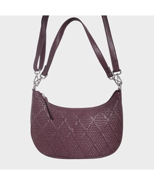 Indulge in luxury with the Assots Premium 'Wonder Weave' Real Leather Woven Designer Shoulder Crossbody Bag. Meticulously crafted with articulate weaving, this bag exudes sophistication and perfection. Its artisanal slot weave creates a unique sense of movement and texture, making it a versatile and luxurious everyday companion. Its versatile design allows it to be worn as a crossbody or shoulder bag, with detachable handles for convenience. Beautiful diamond shaped weaving with the finest full grain genuine leather. Detachable shoulder and crossbody handles to be worn as a crossbody bag or a shoulder bag. Lightweight. Secured zip closure opens to a fully lined and roomy compartment to accommodate all your essentials. Internal zip pocket for your smartphone, house keys and car keys. Available in 13 more elegant colours. Fittings Colour: Silver Nickel. Composition: Body: 100% Genuine Leather, Lining: Polyester. DISCLAIMER: All pictures shown are for illustration purpose only. Actual product colour may vary due to different ambience lighting or the screen display settings. Size- W29cm x H18cm x D8cm.
