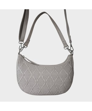 Indulge in luxury with the Assots Premium 'Wonder Weave' Real Leather Woven Designer Shoulder Crossbody Bag. Meticulously crafted with articulate weaving, this bag exudes sophistication and perfection. Its artisanal slot weave creates a unique sense of movement and texture, making it a versatile and luxurious everyday companion. Its versatile design allows it to be worn as a crossbody or shoulder bag, with detachable handles for convenience. Beautiful diamond shaped weaving with the finest full grain genuine leather. Detachable shoulder and crossbody handles to be worn as a crossbody bag or a shoulder bag. Lightweight. Secured zip closure opens to a fully lined and roomy compartment to accommodate all your essentials. Internal zip pocket for your smartphone, house keys and car keys. Available in 13 more elegant colours. Fittings Colour: Silver Nickel. Composition: Body: 100% Genuine Leather, Lining: Polyester. DISCLAIMER: All pictures shown are for illustration purpose only. Actual product colour may vary due to different ambience lighting or the screen display settings. Size- W29cm x H18cm x D8cm.