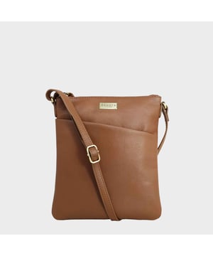 Beautifully handcrafted from natural pebble grain 'Guild' leather, the 'Linby' crossbody bag is a lightweight easy to wear option ideal for work or weekend. A modern design hands-free style to keep all your daily essentials organised and close to hand. A must-have addition to your collection of handmade leather bags. It features a secured metal zip top opening and a stylish slanted slip-in pocket at the front for quick and easy access.Carry it comfortably with an adjustable leather shoulder strap. Zip top opening secures the capacious fully lined main compartment. Stylish slanted slip-in pocket at the front for quick and easy access. Comes with an adjustable shoulder strap for a comfortable carry. Adorned with an Assots London brushed gold plate. Internal features, include: 
Slip-in pocket for your smartphone. Fittings: Antique Brass
Composition: Body: 100% Genuine Leather. Lining: 100% Polyester.
DISCLAIMER : All pictures shown are for illustration purpose only. Actual product colour may vary due to different ambience lighting or the screen display settings. Size - W21cm x H24cm x D1cm.