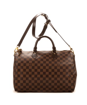 Louis Vuitton Tassen Speedy Bandouliere 35 Handtas in de Bruin Gecoat canvas in de Gouden Messing  hardware. Het product is in In Uitstekende Staat (A).
  Afmetingen: 35x23x18 cm 
  Inclusief accessoires: Strap
      
  BrandCo Paris vindt zeldzame artikelen in de beste staat voor ongelooflijke prijzen. Het is de moeite waard om geduldig te zijn! Koop met vertrouwen: alle artikelen van BrandCo Paris worden zorgvuldig geselecteerd en geverifieerd door ons team van experts.

  Alle artikelen worden geleverd met een certificaat van echtheid en verpakt door BrandCo Paris.

  Classificatietabel voor de conditie van het artikel:

  N (als nieuw)
  AA (perfecte staat)
  A (uitstekende staat)
  AB (zeer goede staat)
  B (goede/redelijke staat)