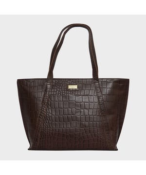 The ‘Agnes’ unlined tote bag is beautifully handcrafted with premium Croc&nbsp;embossed genuine leather for that designer look. It features slip-in&nbsp;pockets both in the front and back of the bag to slide in your daily essentials.&nbsp;This Croc Leather shopper is designed to ensure you don’t run out of space and have ample room for your necessities when you’re out and about. Walk in style with ‘Agnes’, the perfect travel companion ideal for all occasions. Secured zip top closure opens to an unlined interior. Slip pockets in the front and back of the bag. Fits a 13-inch laptop. Double Stitching on the handles for extra reinforcement. Reinforced base to avoid bulging when stuffed. Unlined shopper to maintain the natural leather look of the bag. Leather shoulder handle for easy pick up and go. Adorned with an Assots London brushed gold clean finish logo. Demonstrating it’s premium quality. Fittings colour: Antique Brass
Composition: Body: 100% Genuine Leather. Lining:  Natural Cotton Lining.
DISCLAIMER: All pictures shown are for illustration purpose only. Actual product colour may vary due to different ambience lighting or the screen display settings. Size- W42cm x H28cm x D10.5cm.
