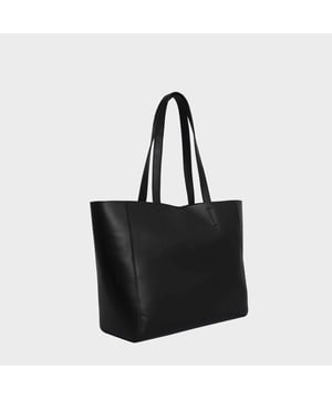 The ‘Abingdon’ large tote bag is beautifully handcrafted with premium smooth and supple full grain leather. Featuring a magnetic closure, this real leather shopper is designed to ensure you don’t run out of space and have ample room for all your necessities when you’re out and about. Stand out with the ‘Abingdon’, a must-have addition to your collection of luxury handbags. Secured magnetic closure opens to a roomy fully lined interior. Easily fits a 13-inch laptop. Double stitching on the handles for extra reinforcement and strength to avoid handle snapping. Reinforced base to avoid bulging when stuffed. Fully lined with an additional zip pocket, slip-in pocket, and mobile pocket. Leather shoulder handle for easy pick up and go. Fittings Colour: Silver Nickel Composition: Body: 100% Genuine Leather. Lining: Polyester
DISCLAIMER : All pictures shown are for illustration purpose only. Actual product colour may vary due to different ambience lighting or the screen display settings. Size- W46cm x H29.5cm x D14cm.