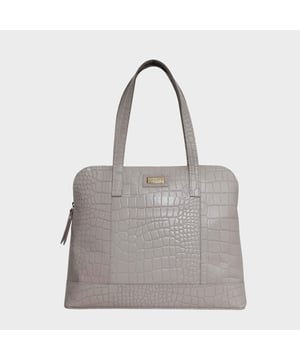 The designer 'Eva' tote bag in black real croc leather is a beautiful timeless design chosen for its lightweight characteristic. Unlined and spacious interiors ensure that you don't run out of space whether you're commuting. Add a touch of sophistication to all your outfits with the 'Eva' tote bag, a must have addition to your collection of handbags. Zip top opens to a roomy interior providing extra security to your belongings. Comes unlined with an exposed, soft to the touch natural leather interior. Extremely lightweight and leather handle for a comfortable carry on your shoulder. Slip pockets on either side to slide in your essentials. Adorned with the inimitable Assots London brushed gold metal logo for that designer look. Fittings Colour: Antique Brass. Composition: Body: 100% Genuine Leather. Lining: Unlined.
DISCLAIMER : All pictures shown are for illustration purpose only. Actual product colour may vary due to different ambience lighting or the screen display settings. Size- W36cm x H28.5cm x D10.5cm.