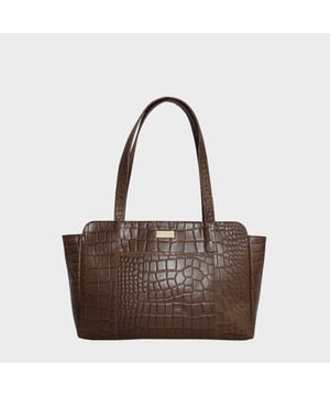 The practical and timeless 'Judith' real leather shoulder bag is beautifully handcrafted from vintage real croc polished finish leather. A classic boat design featuring multiple zip and slip pockets to organise all your essentials when you're out and about. Ideal for everyday use, this genuine leather piece is a must-have addition to your collection of handbags.
Zip closure opens to a fully lined spacious interior to accommodate all your essentials. The lining used is the signature Assots London branded polyester mix fabric. Secured full-width zip pocket at the back and slip pocket at the front to slide in your essentials. Leather shoulder handles for a comfortable carry and easy pickup and go. Adorned with the inimitable Assots London metal logo for a clean finish. Additional internal zip pocket and two slip-in pockets for your face covering, house keys, car keys and sunglasses. Fittings colour: Antique brass. Composition: Body: 100% Genuine Leather. Lining: Polyester.
DISCLAIMER : All pictures shown are for illustration purpose only. Actual product colour may vary due to different ambience lighting or the screen display settings. Size- W40cm x H22.5cm x D8cm.