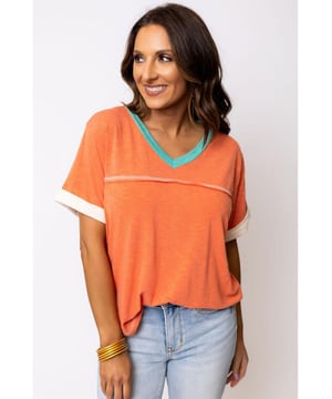 Grapefruit Orange Contrast Trim Exposed Seam
  V Neck T
  shirt
  Trendy contrast trim adds a color block effect
  Visible stitching creates a unique and fashionable look
  V
  neck cut flatters your neckline and adds a feminine touch
  Soft and breathable fabrics
  Perfect for everyday wear
  High elasticity
  Unisex
Material: 65% Polyester 35% Cotton