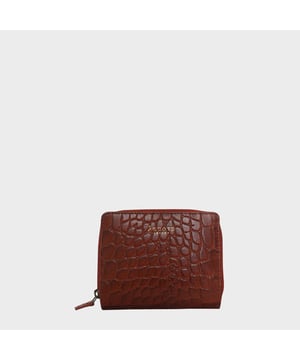 The 'Jolly' compact RFID equipped wallet purse is perfectly handcrafted with premium vintage Croc real leather for that designer look. This timeless design wallet purse easily fits in your bag or pocket featuring multiple card slots, slip pockets and a zip pocket. Organise your belongings with ease with 'Jolly' the perfect medium sized wallet purse.
Riveted closure for safe and secure storage. Zip compartment for you to store your coins and keys. Equipped with RFID technology to keep you safe from modern theft. Three card slots and three slip pockets for you to store your cards and notes. Compact size fitting easily in your bag or pocket. Fittings: Clean Brass. Composition: Body: 100% Genuine Leather. Lining: Polyester.
DISCLAIMER : All pictures shown are for illustration purpose only. Actual product colour may vary due to different ambience lighting or the screen display settings. Size- W11cm x H9.5cm x D2cm.