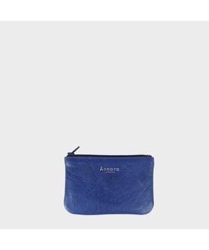 Assots 'Poppy' is a cute mini leather accessory handcrafted to compliment your collection of genuine leather handbags. Its simple and compact design is what makes this leather coin purse super practical and purposeful. Whether you prefer to carry one in lieu of a purse or keep one filled with change tucked inside your handbag, these pretty little things come in assorted colours.
Develops a unique rich patina with use to cherish over the years to come. Secured zip top closure. Embellished with an Assots London golden foil logo in the front. Opens to a fully lined interior in matching colour. Composition: Body: 100% Genuine Leather. Lining: Polyester.
DISCLAIMER : All pictures shown are for illustration purpose only. Actual product colour may vary due to different ambience lighting or the screen display settings. Size- W12cm x H8.5cm x D1cm.