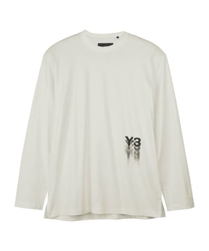 Y-3 Graphic Long Sleeve T-Shirt in off white. The Y-3 Graphic Long Sleeve Tee represents an evolution of running design from the Yohji Yamamoto archives. The cotton jersey build hangs loose and relaxed  and the Y-3 logo blurs on the front as if it's in motion  unrestrained.- A loose-fit graphic tee by Y-3.- Loose fit.- Ribbed crew neck.- Long sleeves.- Side hem slits.- Y-3 logo.- 100% cotton.  Machine washable.- Ref: IZ3121