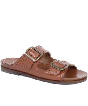 Introducing the ultimate pair of ladies casual mule sandals, perfect for those who like to keep their style effortless yet elegant. Crafted from premium leather and adorned with silver studded embellishments, these sandals will step you through any day to night look.