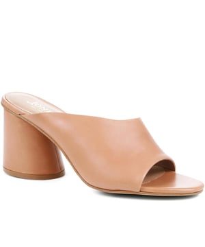 Keep it chic and endlessly comfortable with these minimalist yet statement mules, all you need to turn heads this season. Whether worn with jeans or dresses, these have all it takes to sign your look off with a 70s edge.