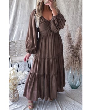 Brown V
  neck maxi dress
  Bowknot on the neckline
  Cutout detailing on the waist
  Frill tiered hem
  High
  quality fabric
  Comfortable fit
  Versatile and suitable for all occasions
  Can be paired with high heels and statement jewelry
Material: 80% Viscose 20% Nylon