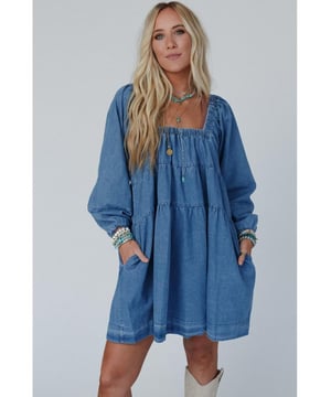 Dusk blue mini dress
  Square neckline for showcasing collarbone and neck accessories
  Loose fit for comfortable wear and relaxed silhouette
  Handy side pockets for a touch of casual style
  Crafted with durable denim for long
  lasting wear
  Available in different sizes. Refer to the size chart for the perfect fit.
Material: 100% Cotton