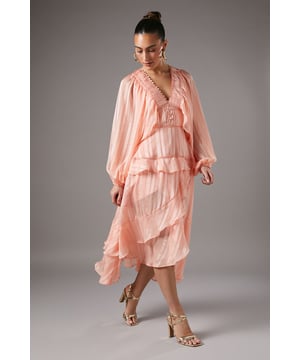 Enchanting jacquard fabric with delicate texture
        Romantic V-neckline framed by cascading ruffles
        Voluminous blouson sleeves for dramatic flair
        Tiered midi skirt with asymmetrical hemline
        Flattering empire waistline accentuates silhouette
    
    Embrace sophistication and elegance with this captivating frill midi dress from Coast. The jacquard fabric adds a luxurious touch, while the blouson sleeves create a striking silhouette. Perfect for weddings, races, or formal gatherings, this dress exudes grace and refinement. Style it with strappy metallic heels and statement earrings for a polished look. For cooler evenings, drape a lightweight shawl over your shoulders. The asymmetrical hemline allows for effortless movement on the dance floor, ensuring you'll feel confident and poised throughout any occasion. This versatile piece can be dressed up or down, making it a valuable addition to your wardrobe for various elegant events.
