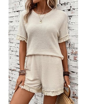 Beige two
  piece set
  Includes tee and shorts
  Textured fabric
  Fringe trim
  Chic boho vibe
  Stylish and comfy
  Perfect for daily and casual occasions
  Refer to size chart for accurate measurements.
Material: 67% Polyester 30% Viscose 3% Elastane
