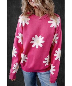 Impresión de flores de margarita en rosa brillante  
Cuello redondo clásico  
Mangas largas  
Construcción de punto con ribete acanalado  
Material: 57% Viscosa 27% Poliéster 16% Poliamida
